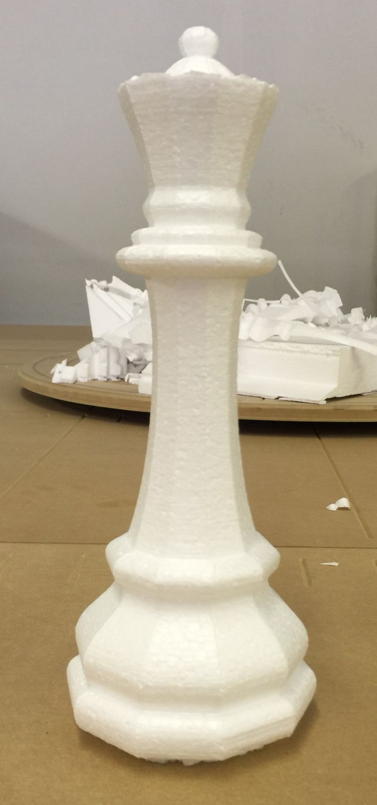 A large chess queen cut from white foam